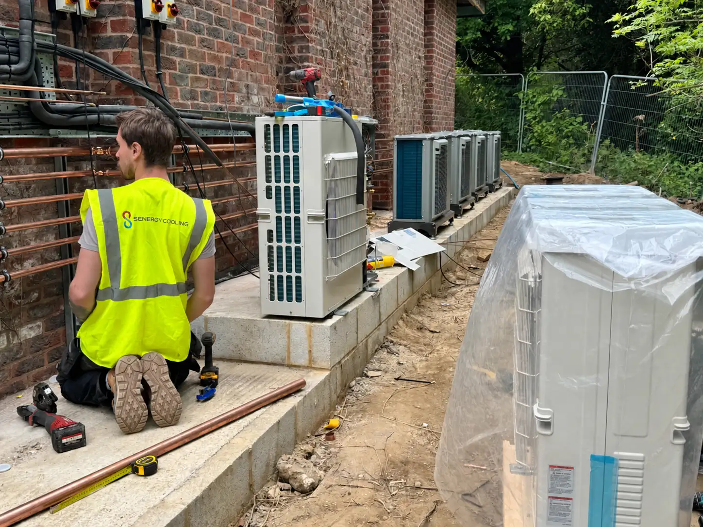 Senergy Cooling engineer working on a commercial air-conditioning installation